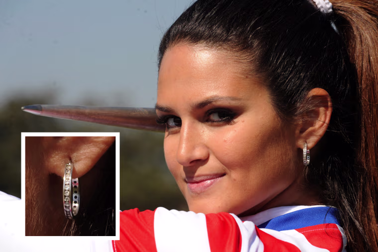Paraguay's Leryn Franco sports hoop earringa in a javelin practice in Asuncion on July 19, 2012, ahead of the London Games.