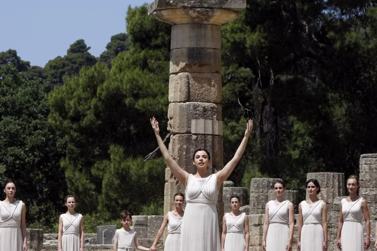Greek actress Ino Menegaki, playing the role of high priestess, takes part in the Olympic torch ceremony at at the site of ancient Olympia in Greece Thursday. Greece could use some help from above as it struggles to solve its deep economic and policital problems.