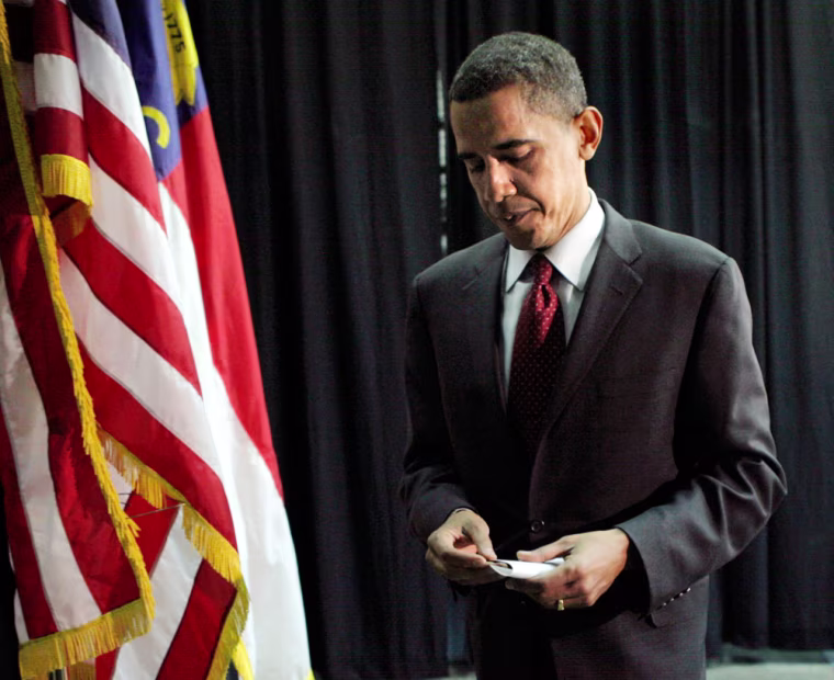 In this file photos, President Obama folds his notes after speaking at news conference on Tuesday, April 29, 2008, about the latest assertion by his former pastor, Rev. Jeremiah Wright, that criticism of his fiery sermons is an attack on the black church.