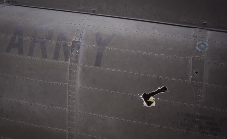 Image of helicopter with bullet hole