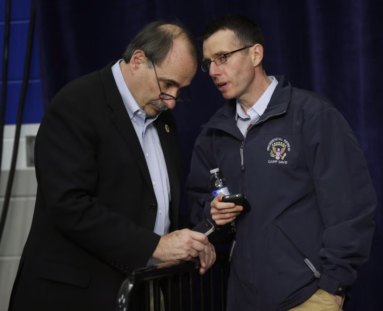 Senior Campaign Adviser David Axelrod, left, and White House Senior Adviser David Plouffe, talk Friday during a campaign event for President Barack Obama at Springfield High School in Springfield, Ohio.