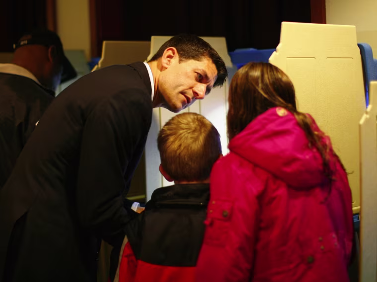Republican vice presidential candidate Paul Ryan and his wife Janna vote during the U.S. Presidential election accompanied by their children Charlie, Sam and Liza in Janesville, Wisconsin November 6, 2012.