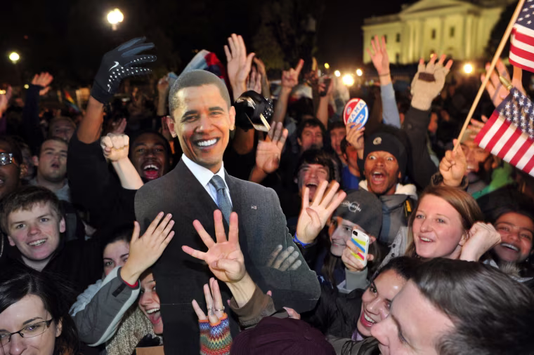 People celebrate with a cardboard cutout of the President Barack Obama in front of the White House in Washington D.C., Nov. 7.