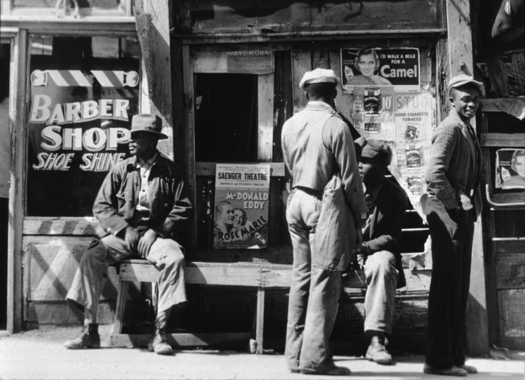 A group of men outside a barber's shop in Vicksburg, Miss., Mar. 1, 1936.