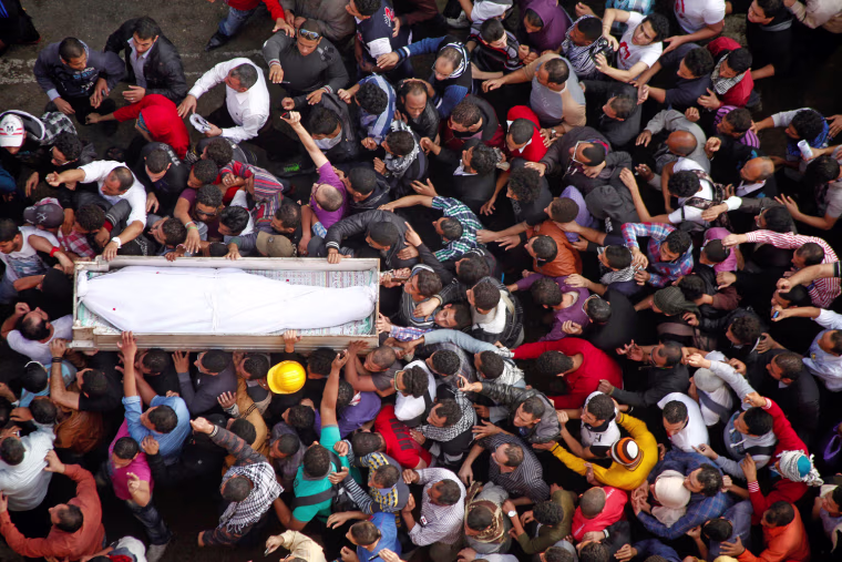 Egyptian activists carry the coffin of Gaber Salah, an activist who died overnight after he was critically injured in clashes with police last week, during his funeral in Tahrir Square on Nov. 26.