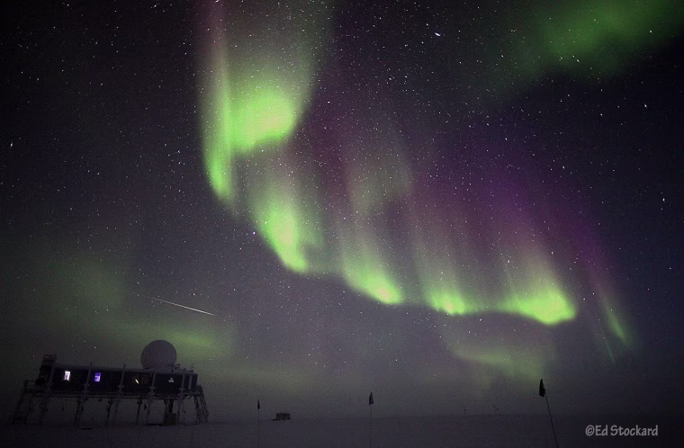 The northern lights ripple over Summit Station on the Greenland ice sheet.