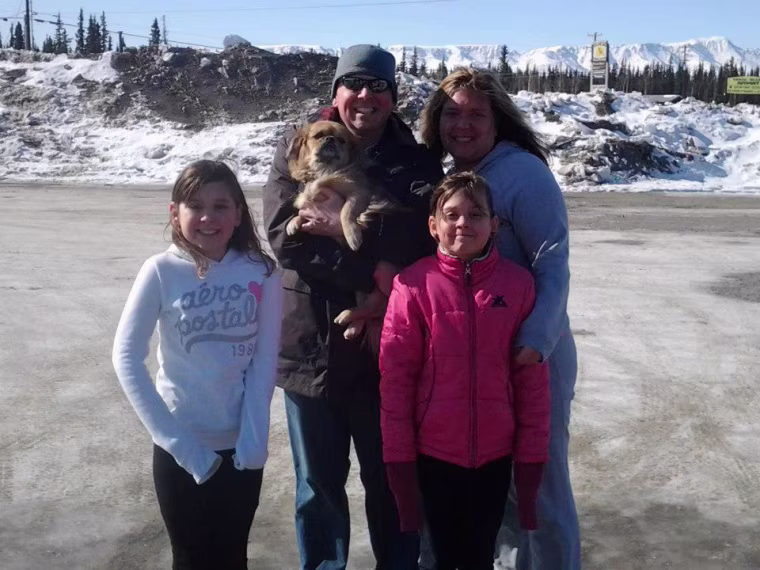 The Kern family poses with their new dog, Shelby, who was rescued from Oklahoma.