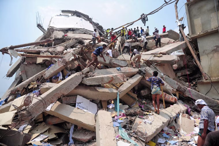 Bangladeshi volunteers and rescue workers search for survivors at the scene of an eight-story building collapse in Savar, on the outskirts of Dhaka, Bangladesh on Thursday.