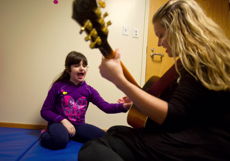 Bari Mogul. 9, works with therapists at The Children's Institute in Pittsburgh, Pennsylvania where Bari and her sister, Hayley, 15, are undergoing extensive therapy to help with their genetic disorders.