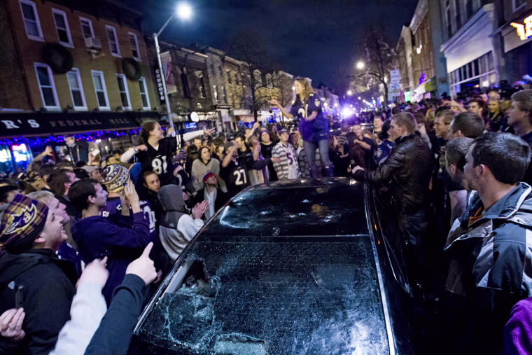 Baltimore Ravens fans celebrate in the streets in downtown Baltimore after their team won the NFL football Super Bowl against the San Francisco 49ers on Feb. 3, 2013.