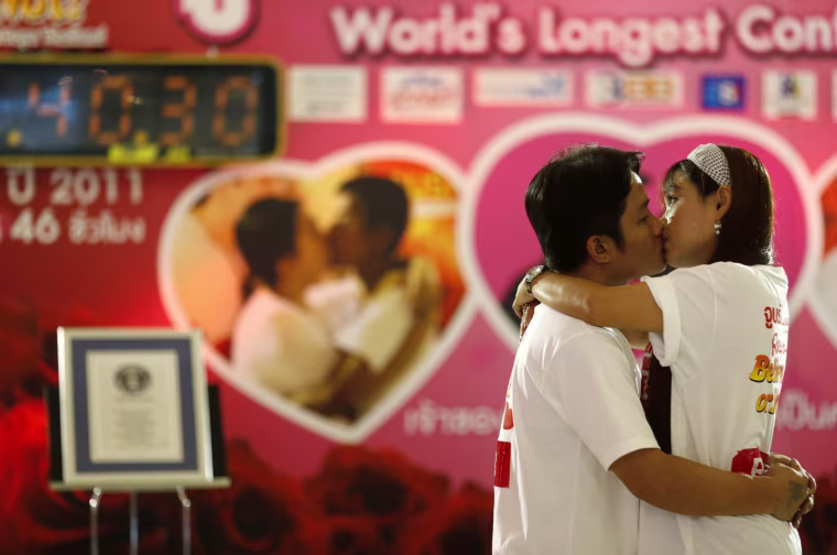 Boontawee Seingwong, 35, kisses his wife Karnchana Kethkaew, 43, in an attempt to break the Guinness World Record for the longest continuous kiss, as part of the upcoming Valentine's Day celebration in Pattaya, Chonburi province, Thailand, on Feb. 12.