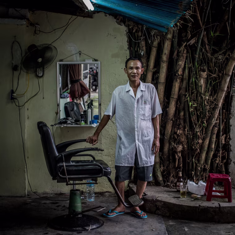 Mr. Khoi, 49, has been a street barber for more than 20 years.