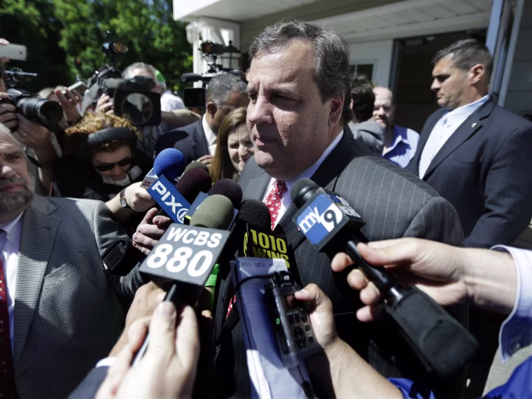 New Jersey Gov. Chris Christie talks to the press after casting his primary election vote, Tuesday, June 4, 2013, in Mendham Township, N.J.