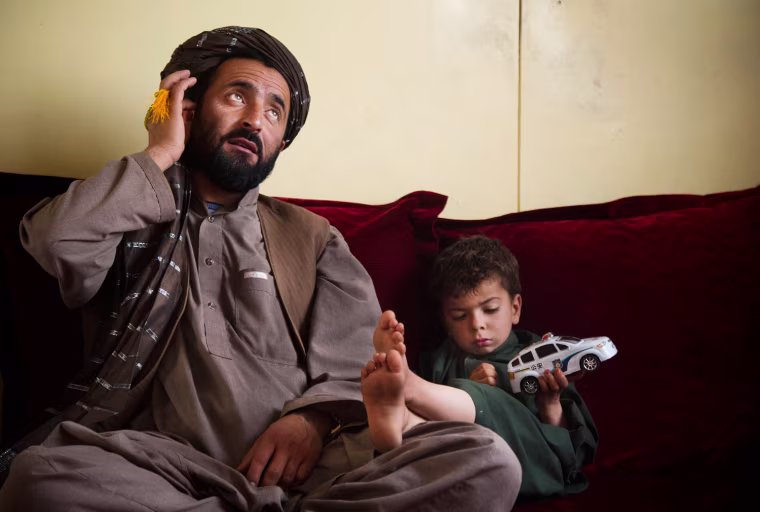 Mohammed Wazir, seen here with his only surviving son, Habib Shahin, 3, lost 11 family members in the attacks by Staff Sgt. Robert Bales, who pleaded guilty on Wednesday.