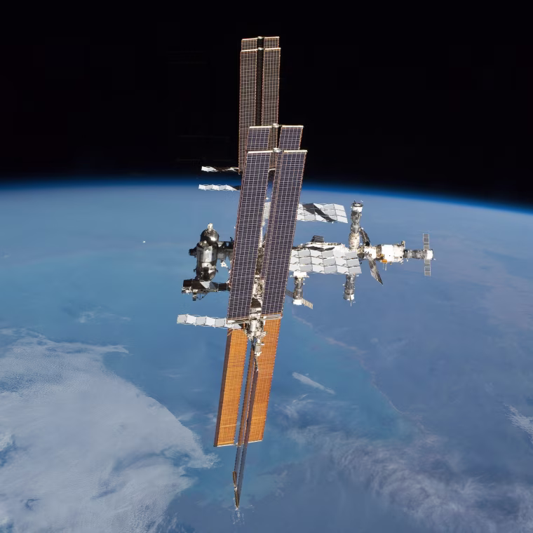 The sun shines brightly on the International Space Station in this parting shot, captured by Atlantis' crew.