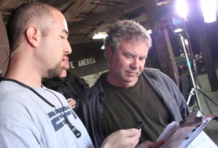 \"Radio Free Albemuth\" writer/director/producer John Alan Simon (right) checks signals with first assistant director Gabe Reiter.