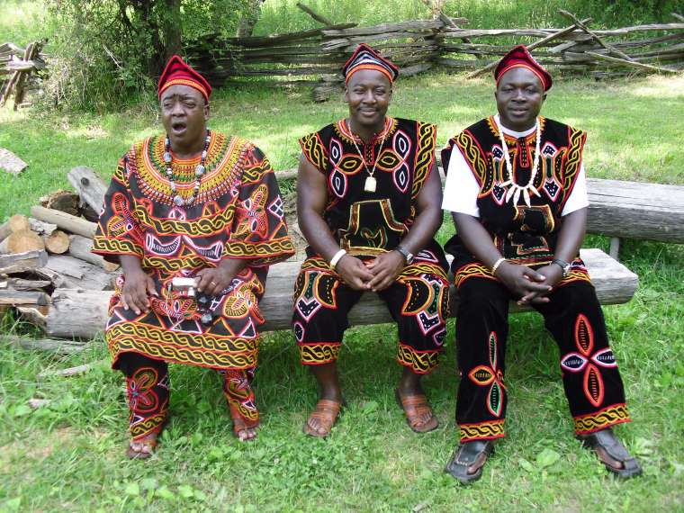 Marvin and William Holland, from left, sit beside Ntomnifor Richard Fru during an African-American reunion in June. Genetic analysis suggests that the Holland brothers are distantly related to Fru's Cameroonian family.