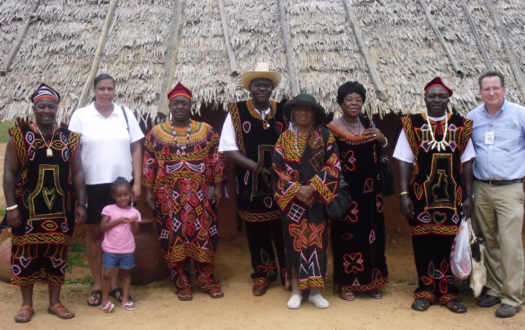 African-Americans and African visitors wear traditional garb at the Frontier Culture Museum's West Africa farm exhibit near Staunton, Va. From left are William (Ndefru) Holland, Regina and Kamari Holland, Marvin (Tsi) Holland, Prince Peter Tseghama Angwafo, Willie Mae (Mankah) Holland, Queen Kiko Anna Angwafo, Ntomnifor Richard Fru and Eric Bryan, the museum's deputy director.