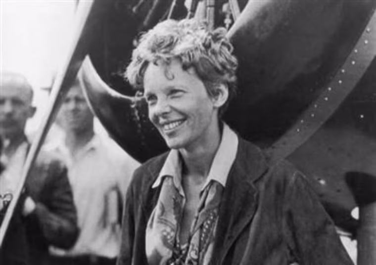 Amelia Earhart exits her aircraft at Derry, Ireland, after her solo transatlantic flight in 1932.