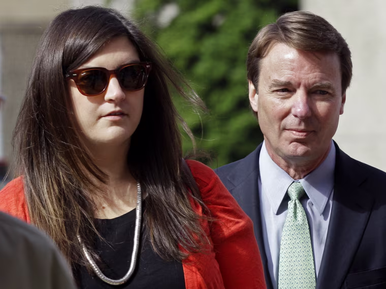 John Edwards arrives with his daughter Cate Edwards at the federal courthouse in Greensboro, N.C., for his trial on charges of campaign corruption Monday, May 21, 2012. Edwards has pleaded not guilty to six counts related to campaign finance violations over nearly $1 million from two wealthy donors used to help hide the Democrat's pregnant mistress as he sought the White House in 2008. (AP Photo/Chuck Burton)