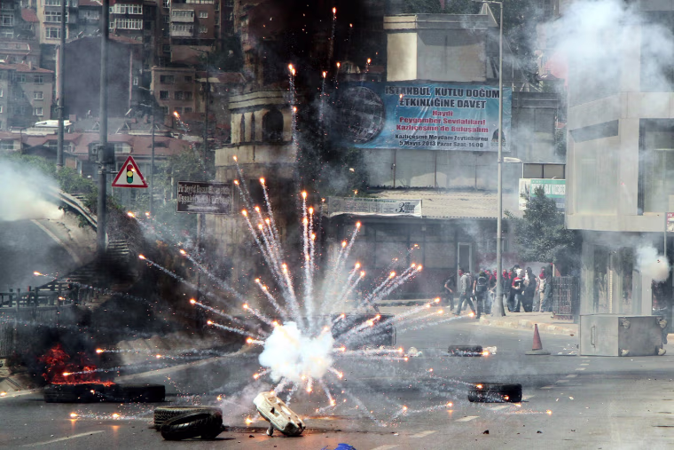 Protestors clash with Turkish riot police during the May Day rally in Istanbul, Turkey. Turkish police and protesters clashed in central Istanbul on 01 May after authorities moved to prohibit traditional Labour Day rallies at Taksim Square. Police used water cannons and tear gas against the demonstrators near Taksim Square. Witnesses reported clashes in several neighbourhoods in the area.