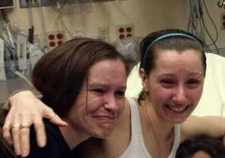 Amanda Berry (right) was reunited with her sister on Monday after Berry and two other women were found alive in a house in Cleveland, Ohio.