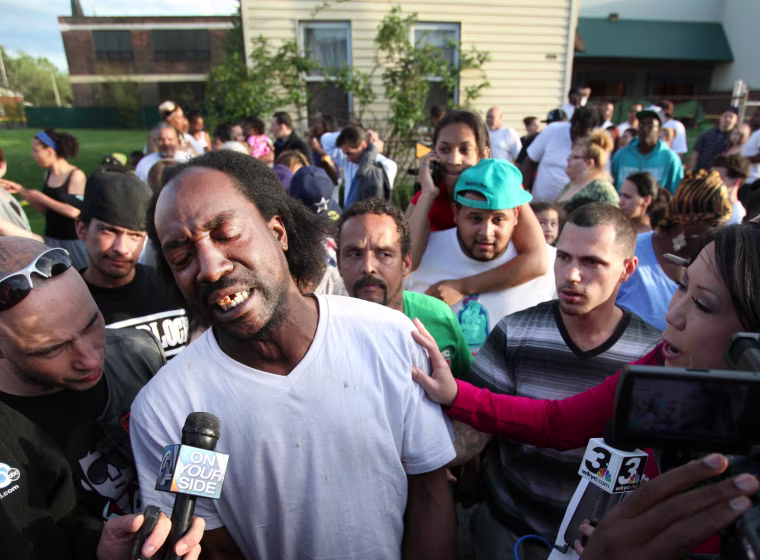 Charles Ramsey talks to members of the media as well-wishers congratulate him in Cleveland on Monday.