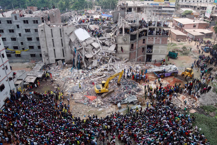 The scene on April 25, 2013, the day after eight-story Rana Plaza building collapsed in Savar, outside Dhaka, Bangladesh, killing more than 900 people.