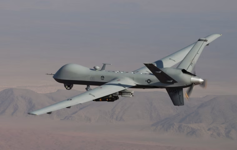This undated handout photo provided by the U.S. Air Force shows a MQ-9 Reaper, armed with GBU-12 Paveway II laser guided munitions and AGM-114 Hellfire missiles, during a combat mission over southern Afghanistan.