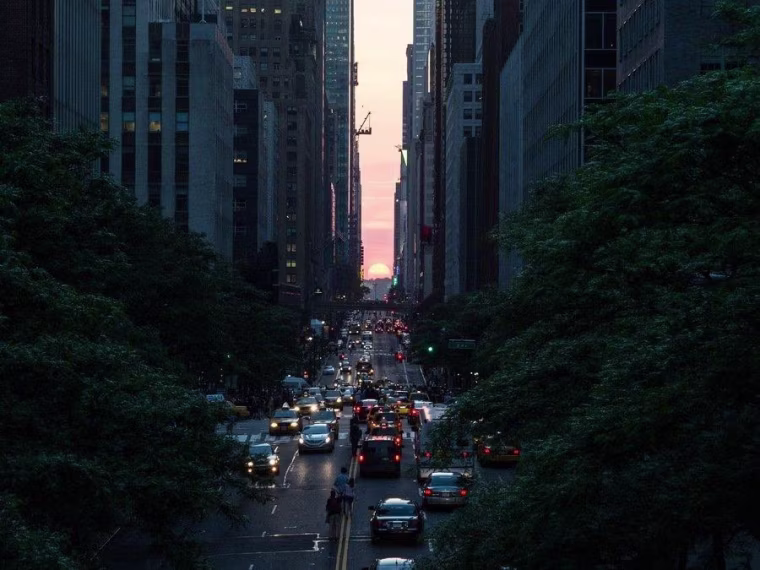 Skyscrapers frame the sun in Andrew St. Clair's Manhattanhenge photograph. Check it out in St. Clair's Flickr photostream.