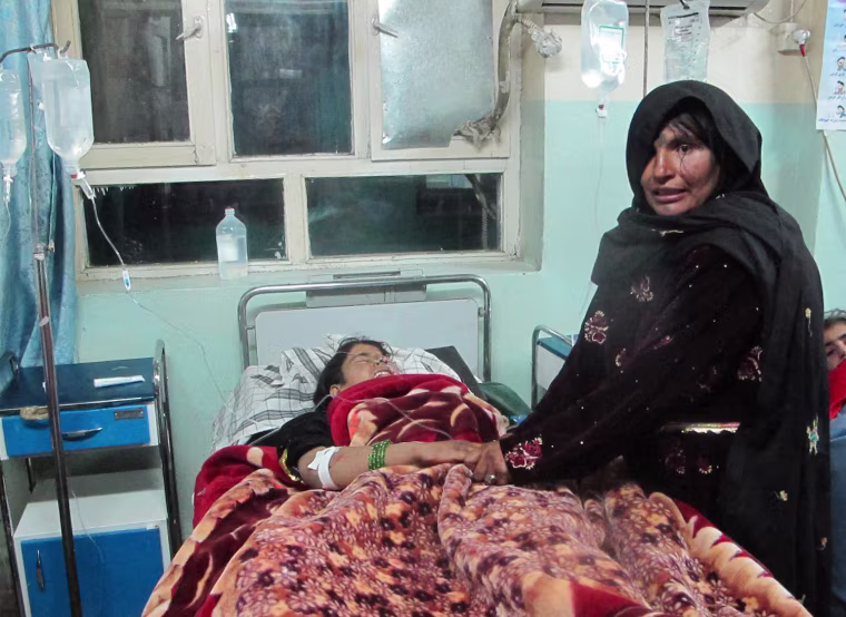 An Afghan girl who was injured in a bomb blast receives medical treatment at a hospital in Ghazni, Afghanistan, 27 October 2013.