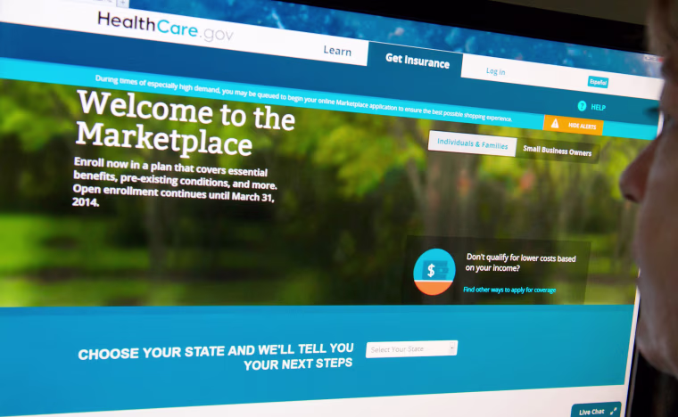 (FILES)This December 2, 2013 file photo shows a woman reading the HealthCare.gov insurance marketplace internet site in Washington, DC. President Bar...