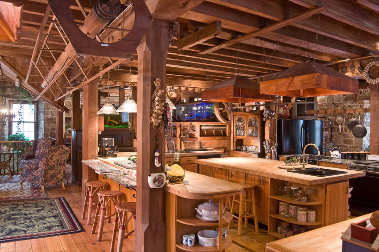 The wood floors of the stone mill, covered with nicks and grooves from former mill workers, were preserved.