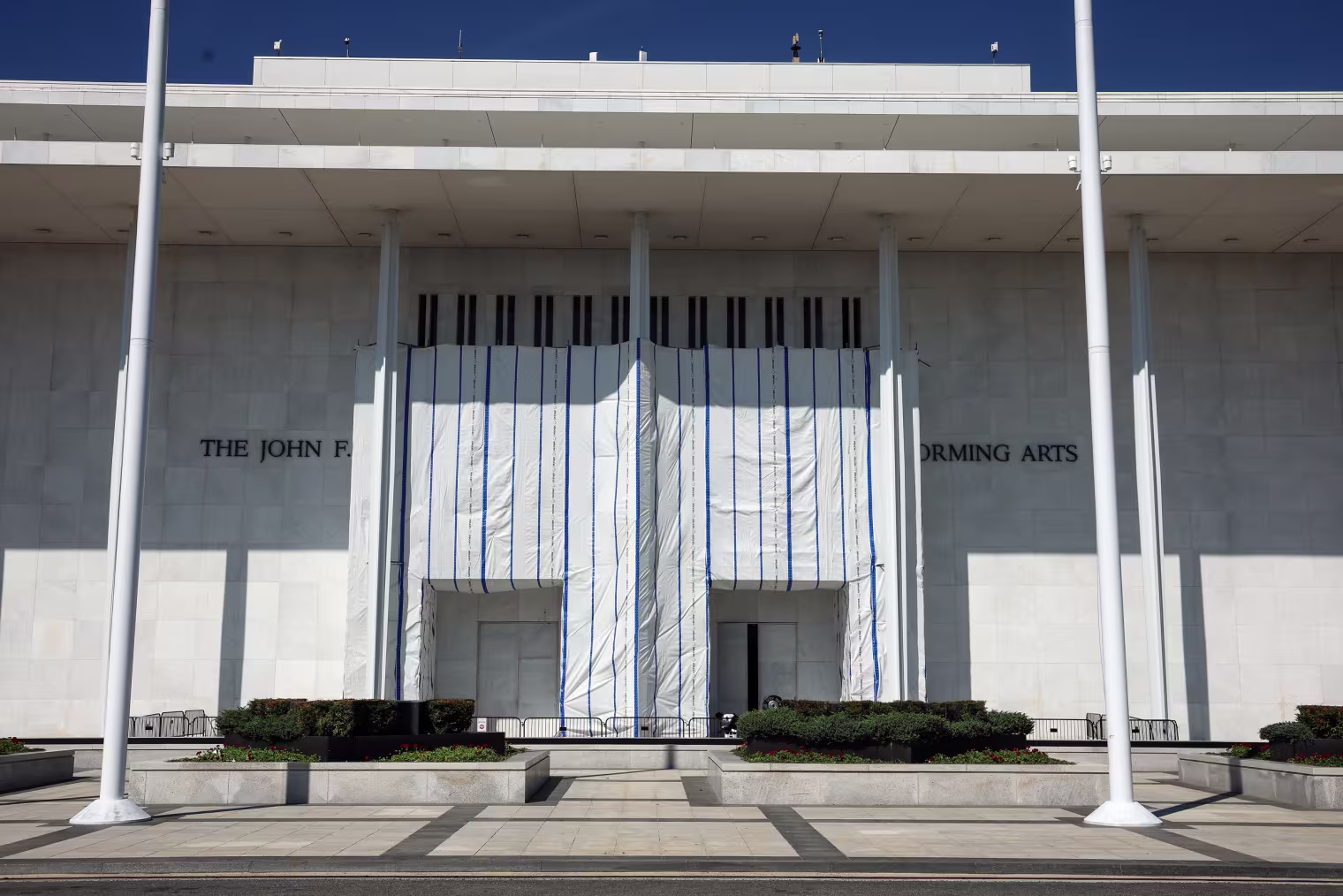 Tarp covering the sign at Kennedy Center