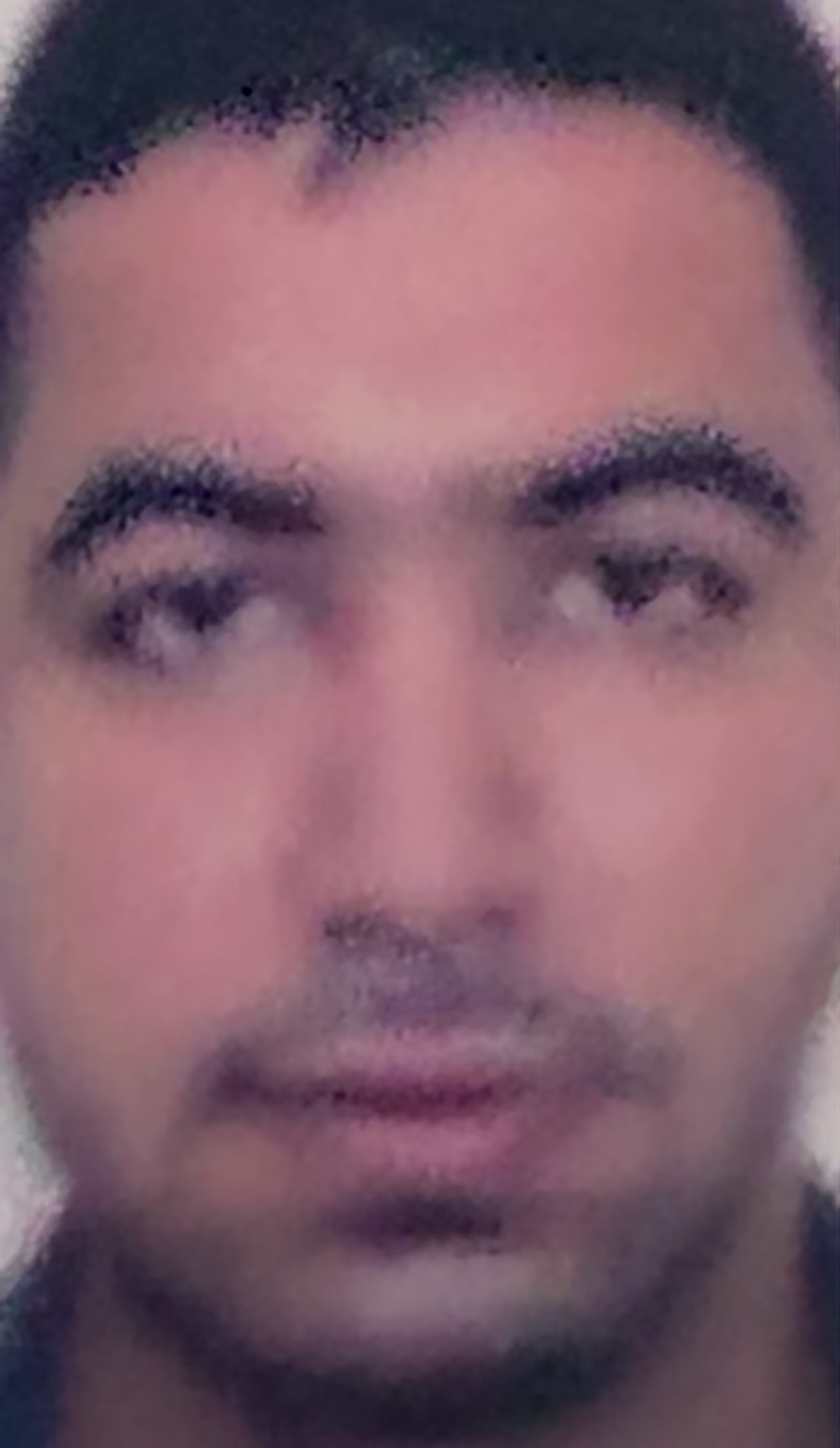 Image: close up headshot of Hamam al-Hammami