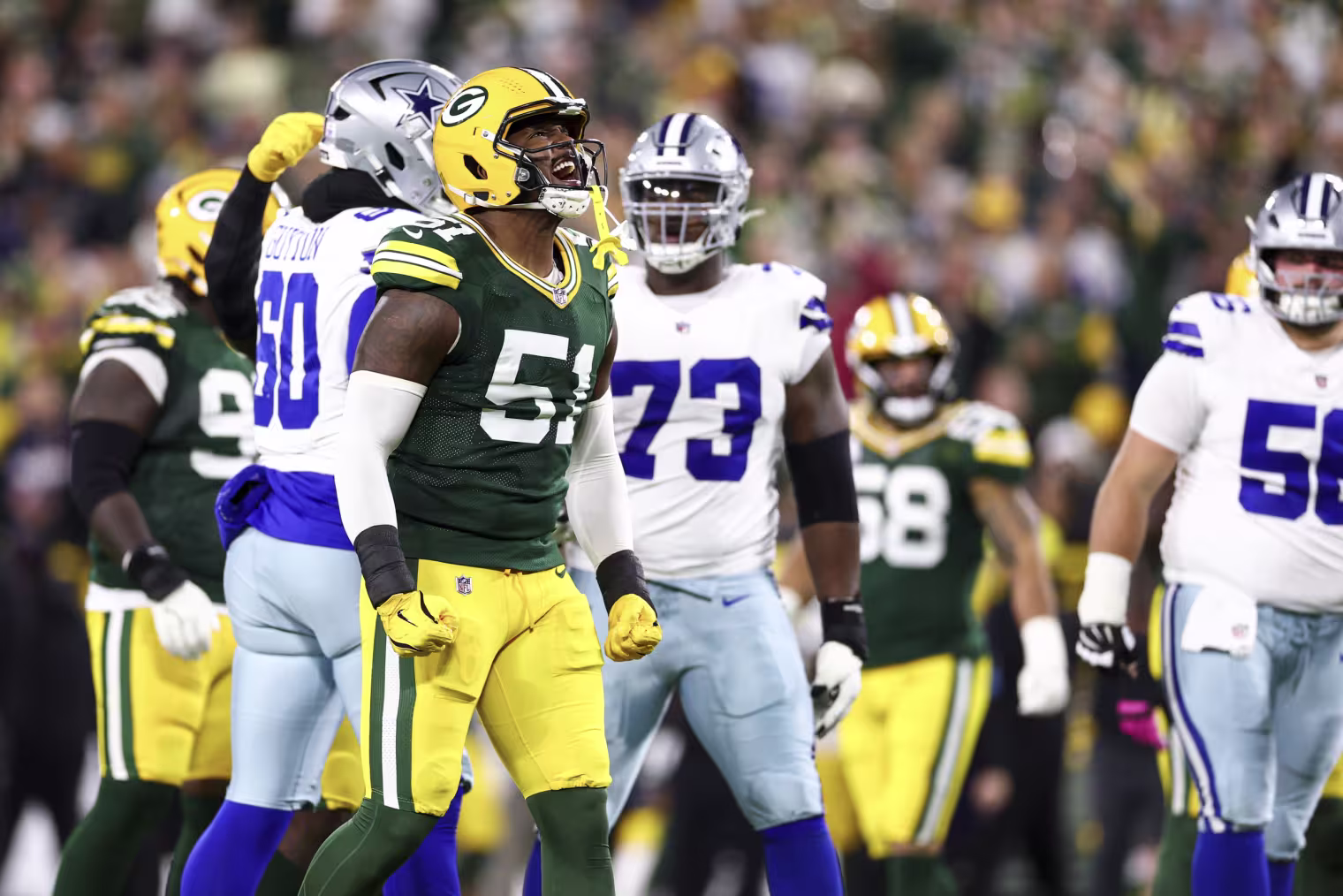 Green Bay Packers defensive lineman Dani Dennis-Sutton celebrates after a play during the first quarter against the Dallas Cowboys at Lambeau Field.
