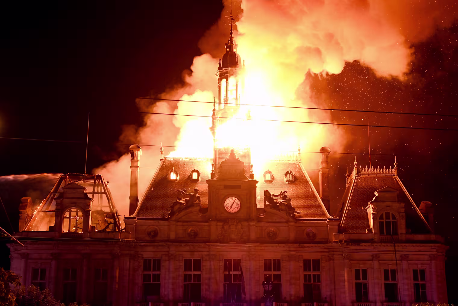 Image: Limoges city hall burning from the building clock tower.