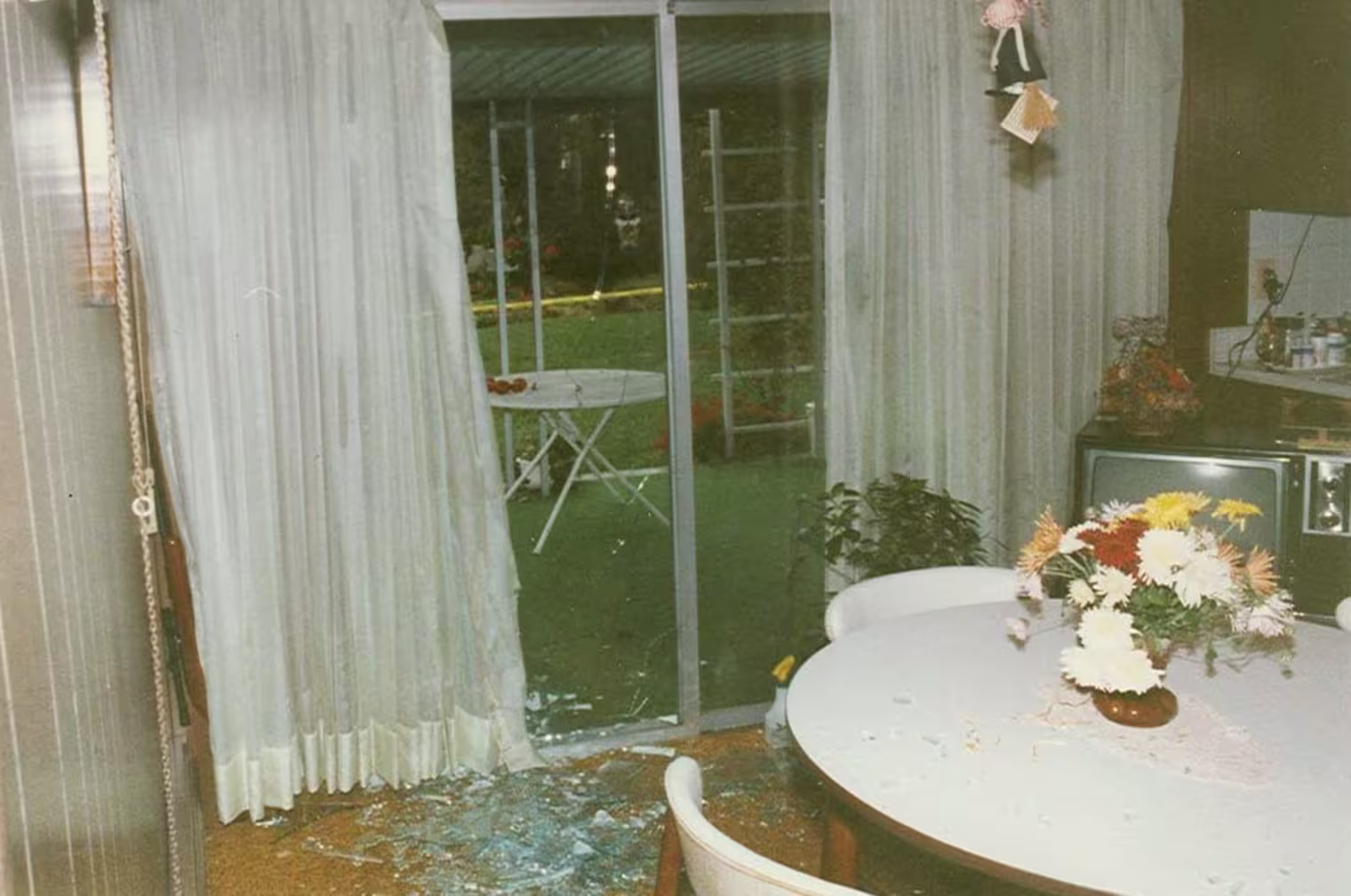The shattered rear sliding door from inside the Furst home.