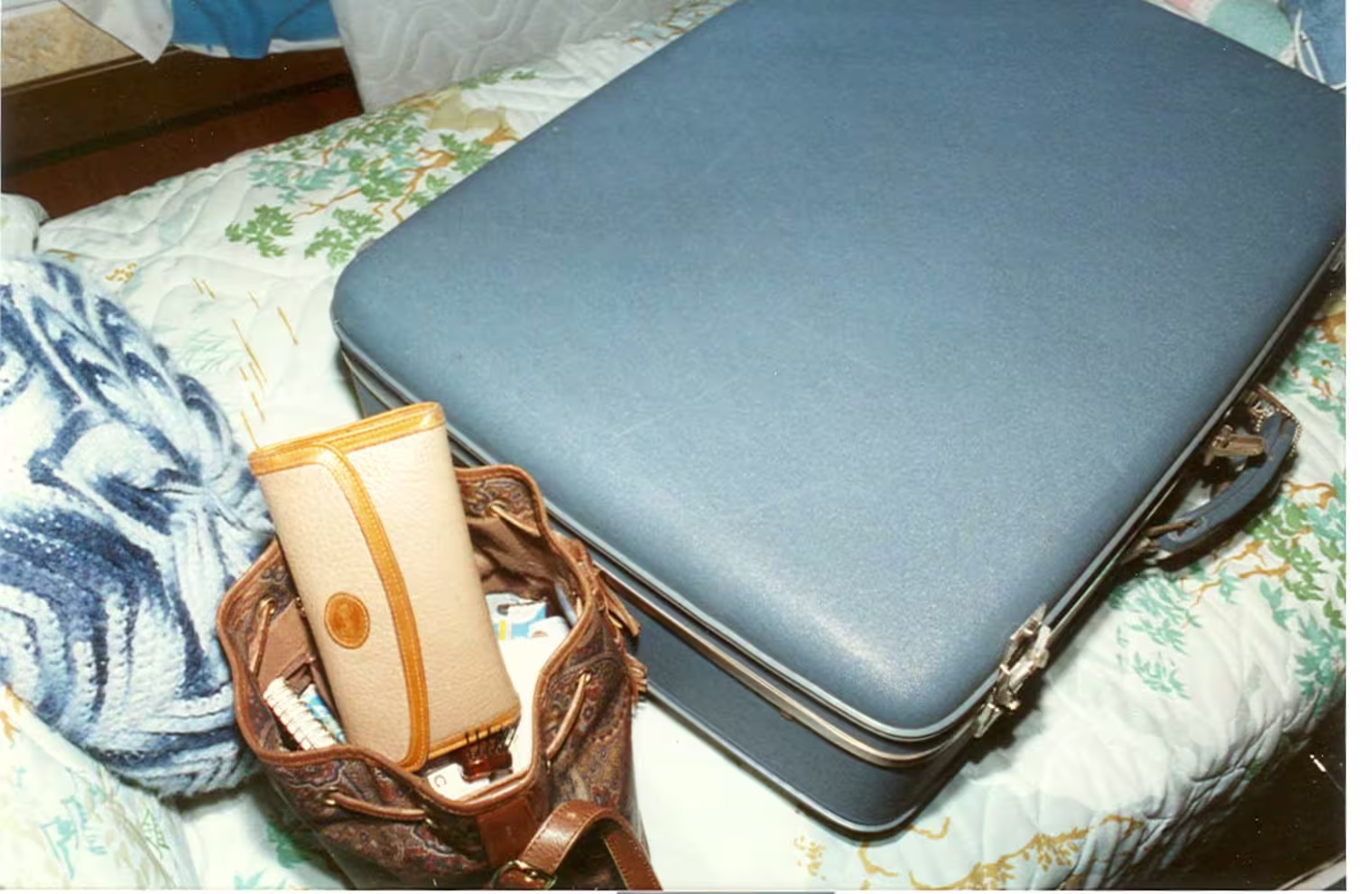 Helen's suitcase, purse and wallet in the secondary bedroom.