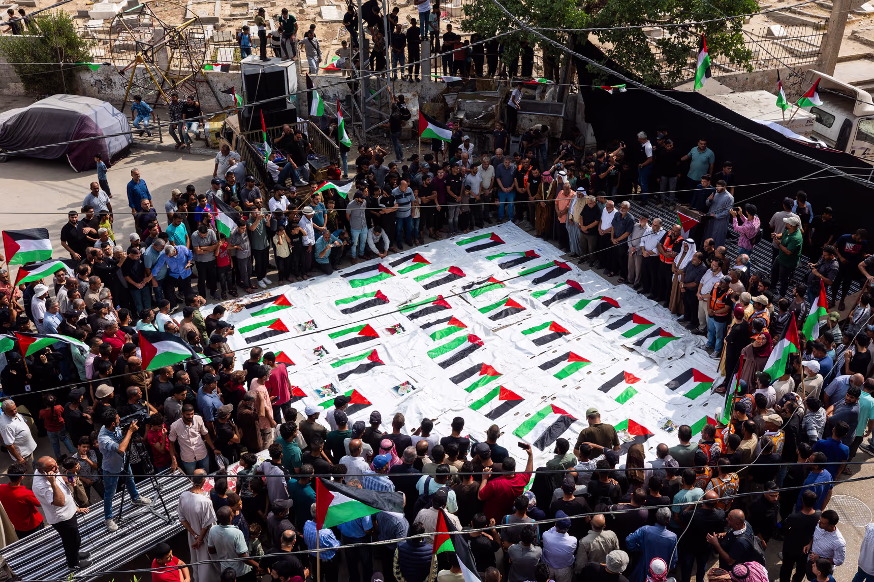 Mass funeral for Palestinians recovered from rubble of destroyed buildings in Gaza