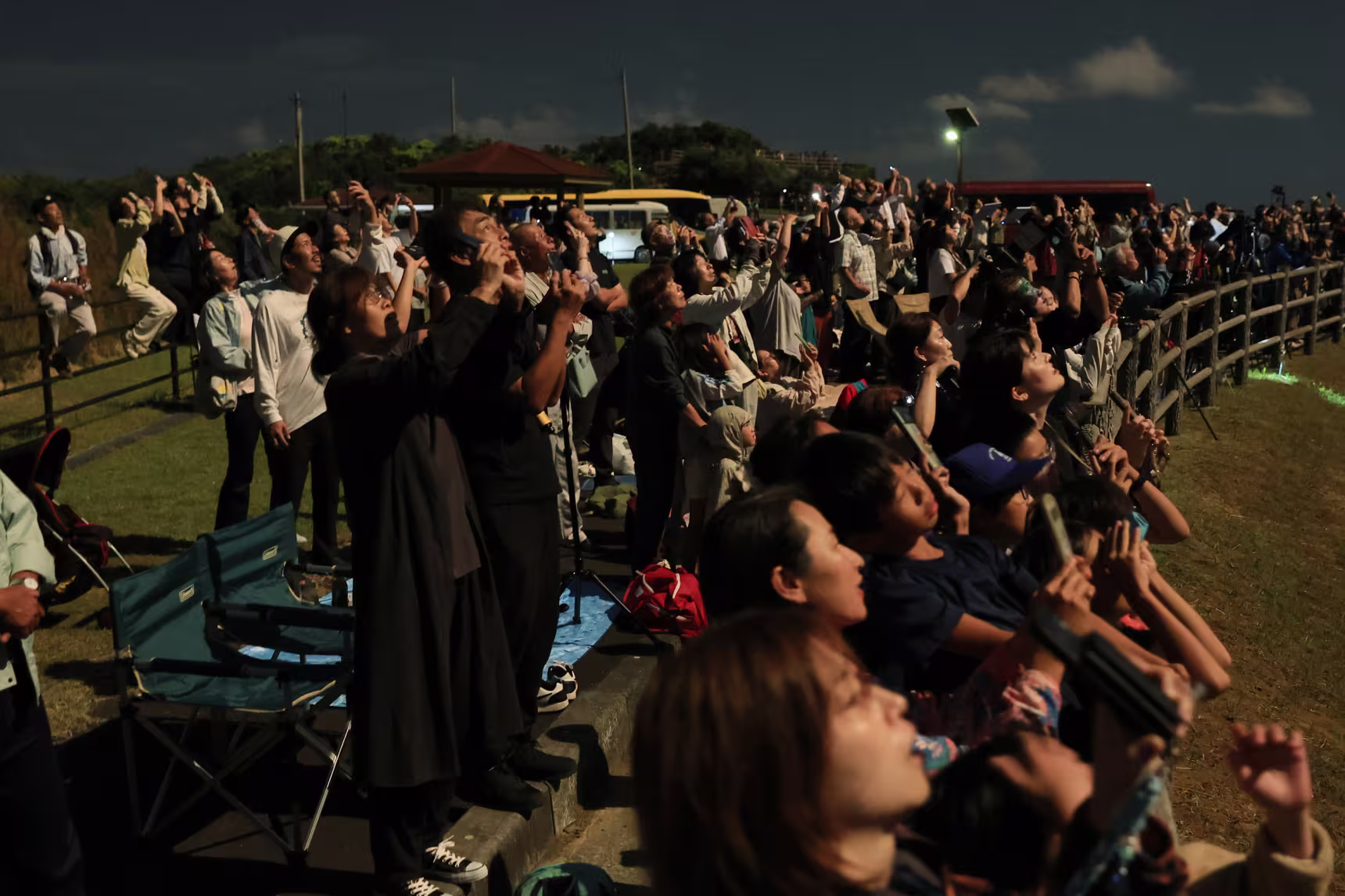 Spectators watch the launch of the H3 No. 10 rocket.