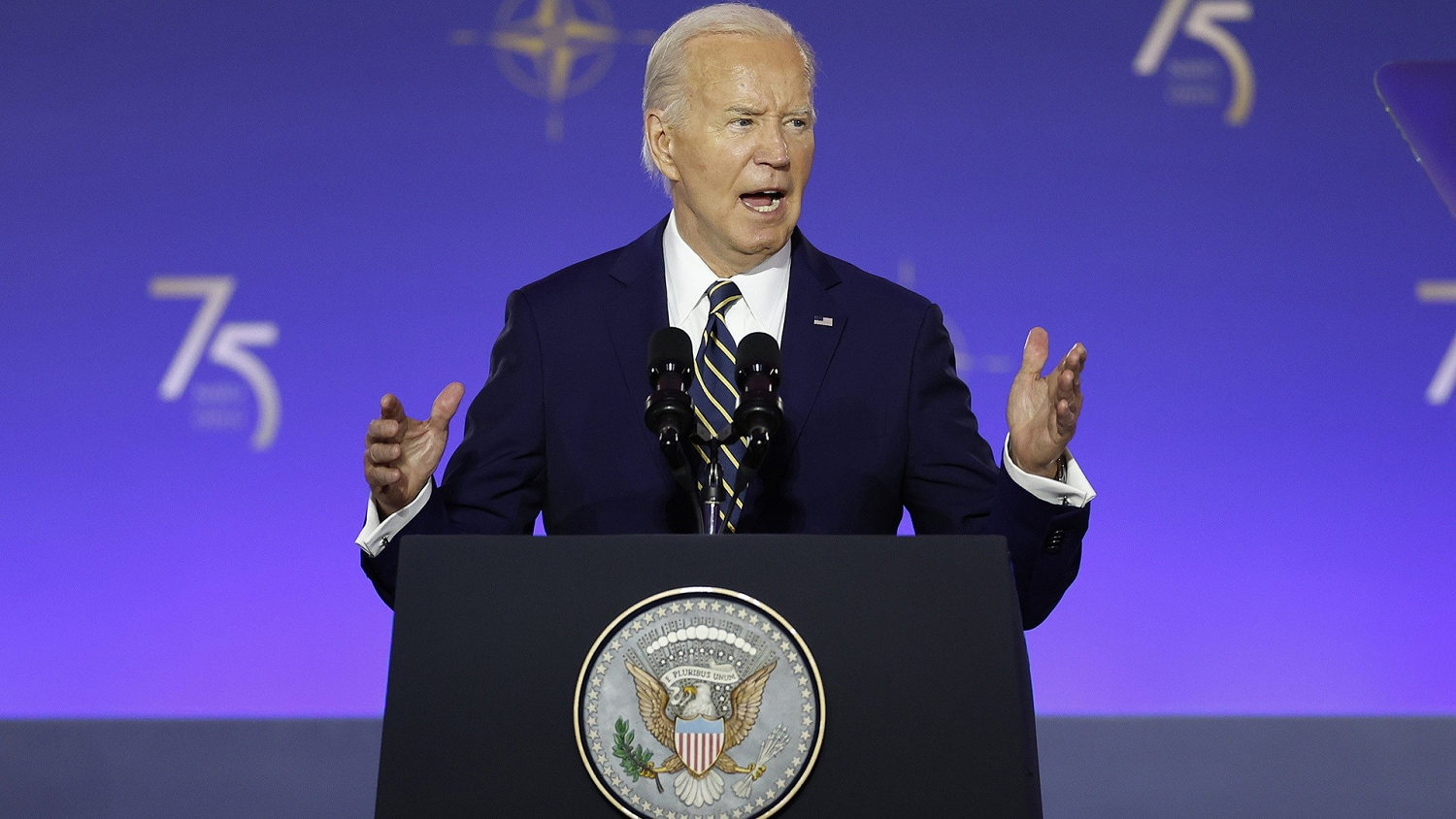 Biden looks to quiet critics with rare solo news conference