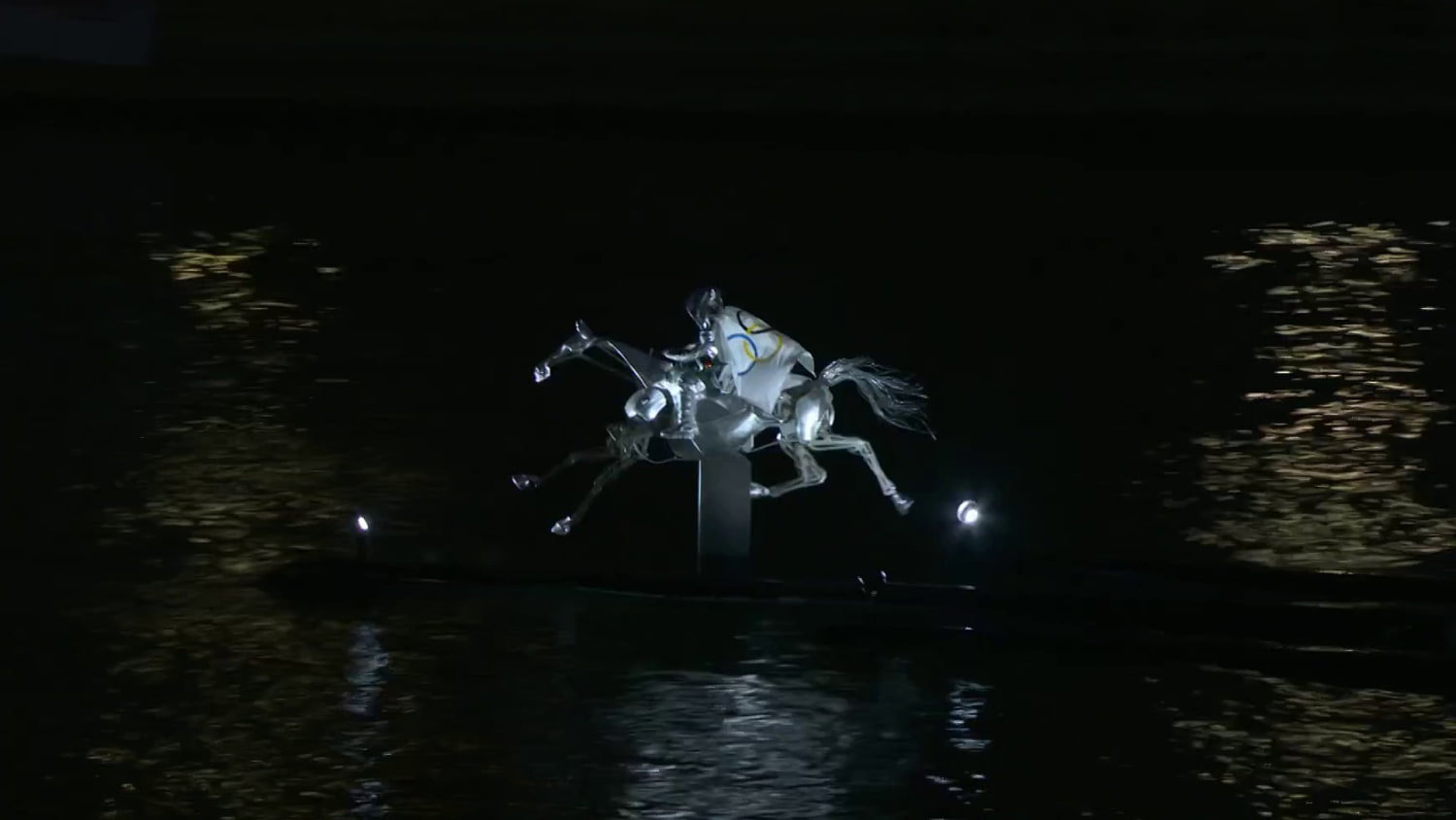 Watch: Metal horse gallops down Seine River at Olympics opening ceremony