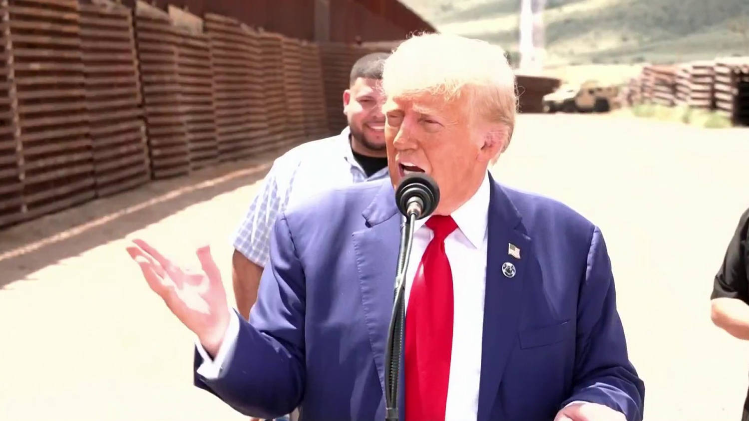 Trump campaigns at border as authorities arrest suspect who threatened to kill him