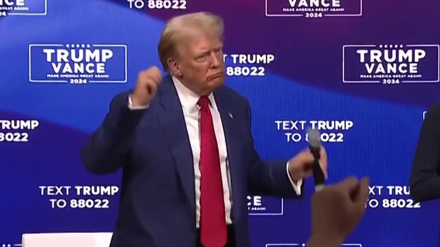 Trump stops answering questions to play music at townhall as Harris questions his fitness