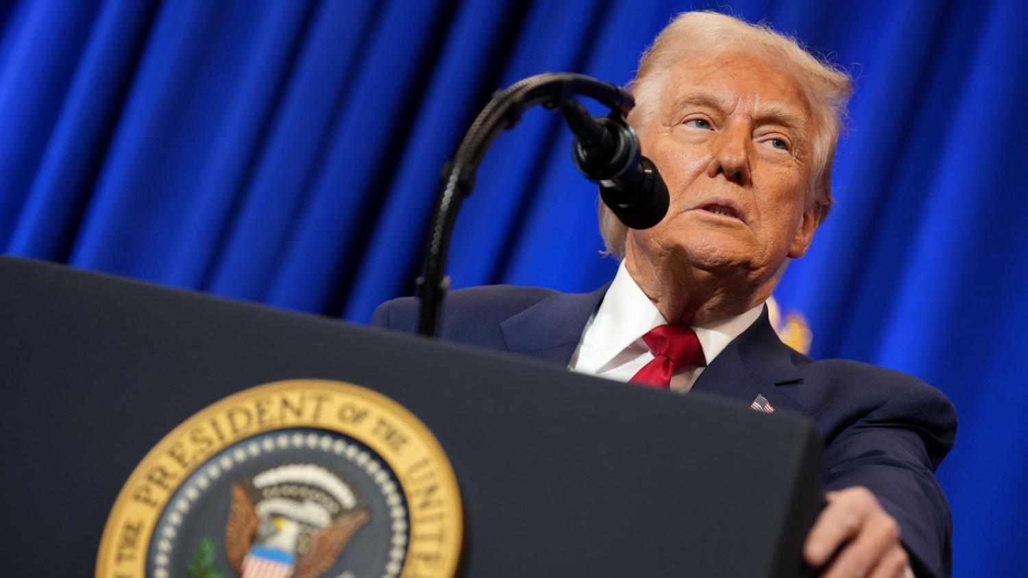 Trump makes rare presidential appearance at Justice Department