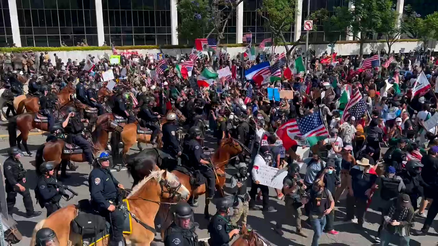 Officers on horseback push back crowds at L.A. ICE protest