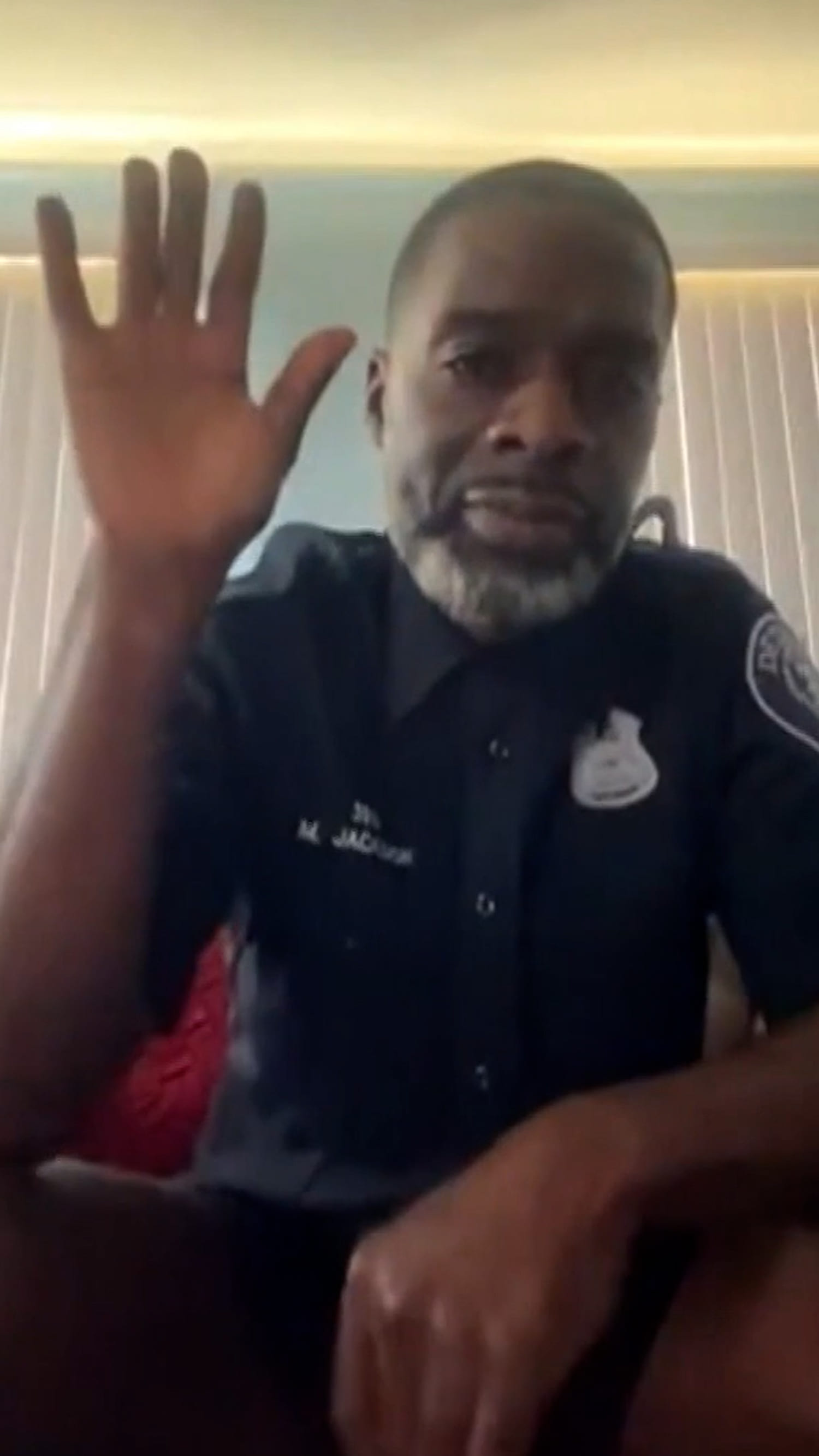 Officer appears to be without pants in virtual court