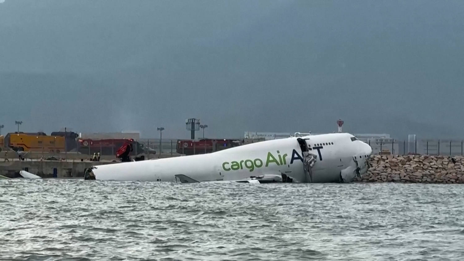 Two ground staff killed at Hong Kong airport after cargo plane skids off runway