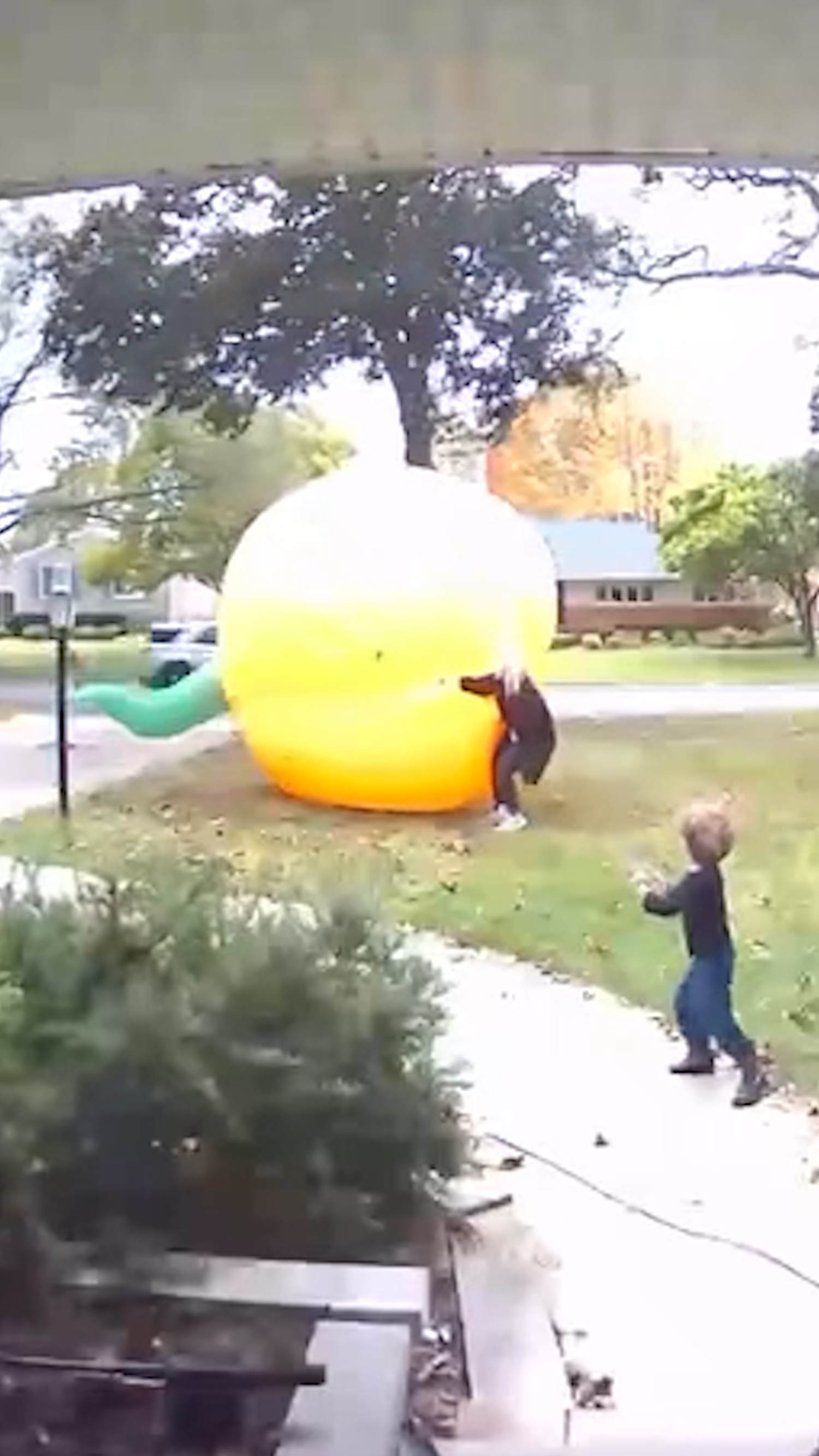 Mom scrambles to control giant inflatable pumpkin